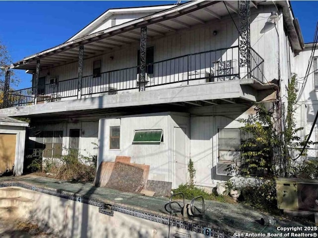 view of home's exterior featuring a balcony