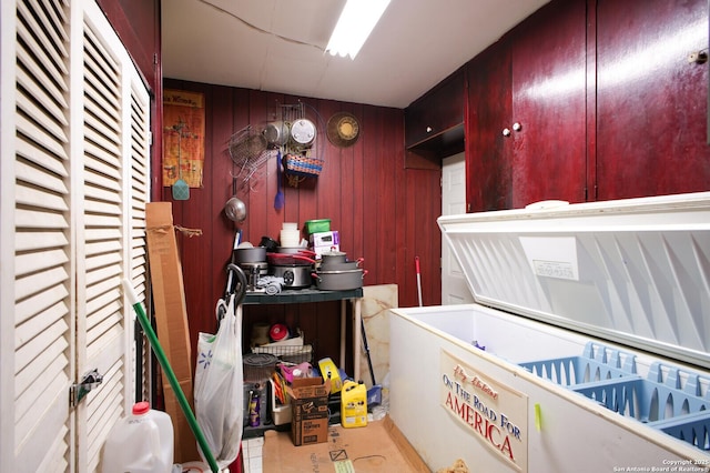 misc room featuring wood walls