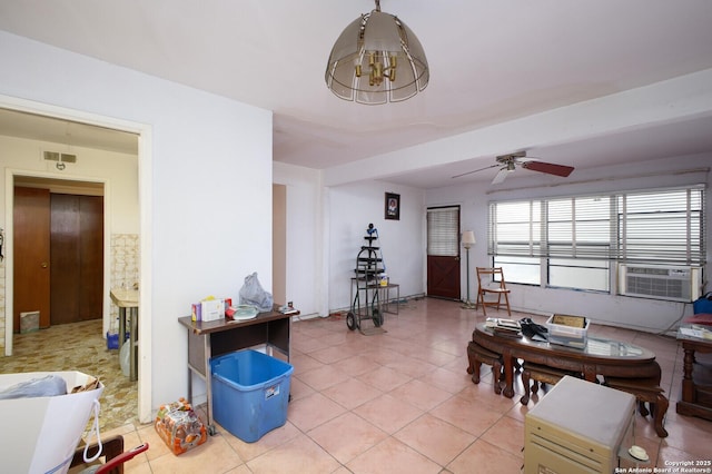 living room with light tile patterned floors, ceiling fan, and cooling unit