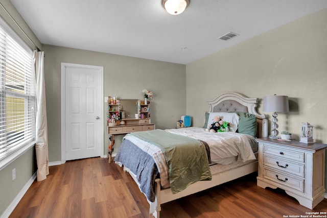 bedroom featuring dark hardwood / wood-style flooring