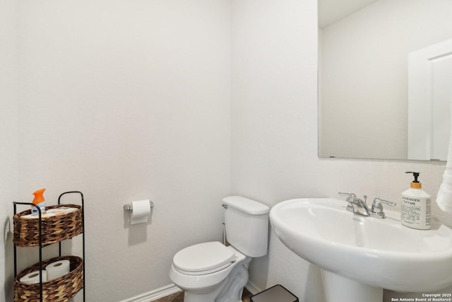 bathroom with toilet and sink