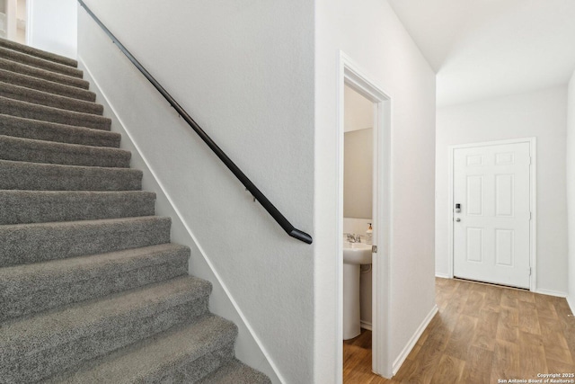 staircase featuring hardwood / wood-style flooring