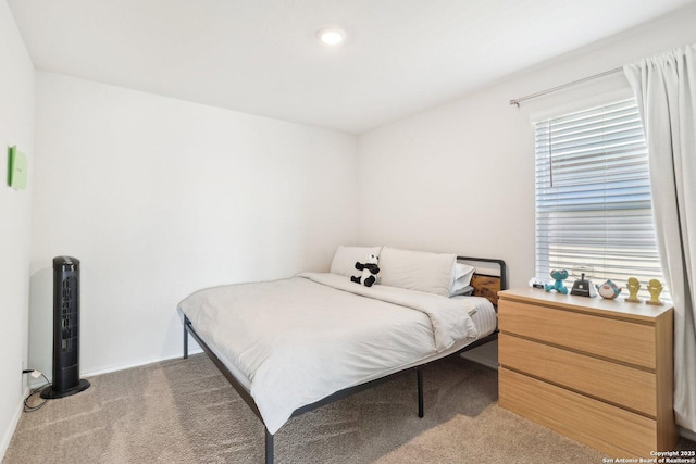 bedroom featuring dark carpet