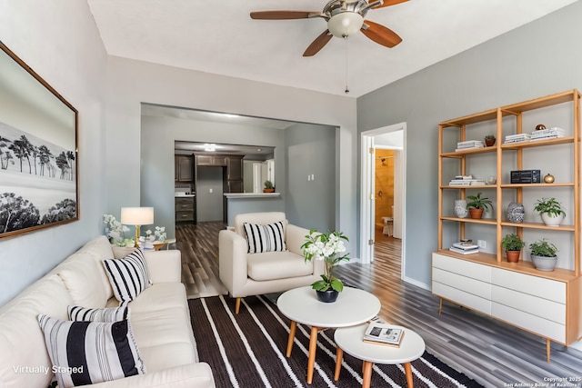 living room with ceiling fan and dark hardwood / wood-style floors