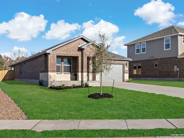 view of front of property with a front yard and a garage