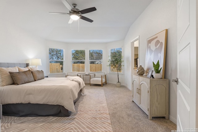 carpeted bedroom featuring ceiling fan and lofted ceiling