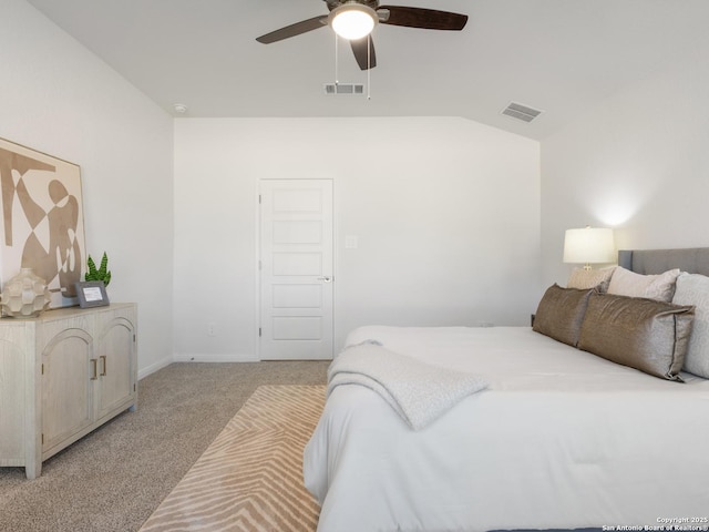 bedroom featuring light carpet, vaulted ceiling, and ceiling fan