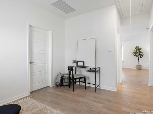 office with light hardwood / wood-style floors