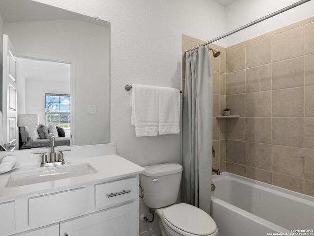 full bathroom with shower / tub combo with curtain, vanity, and toilet