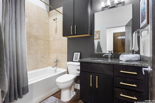 full bathroom with vanity, toilet, and shower / bath combo with shower curtain