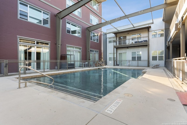 view of swimming pool with a patio area