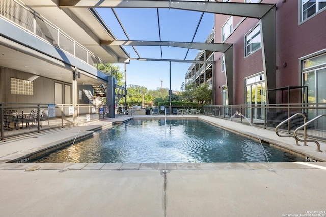 view of pool featuring pool water feature and a patio area