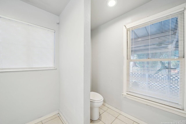 bathroom with tile patterned flooring and toilet