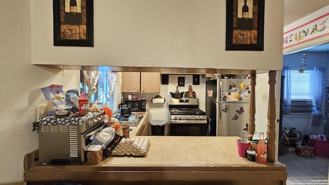 kitchen with light tile patterned floors, stainless steel appliances, and cooling unit