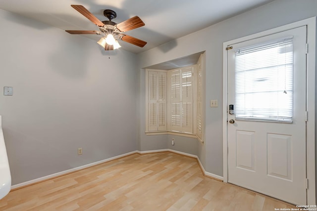 entryway featuring light wood-type flooring, plenty of natural light, and ceiling fan