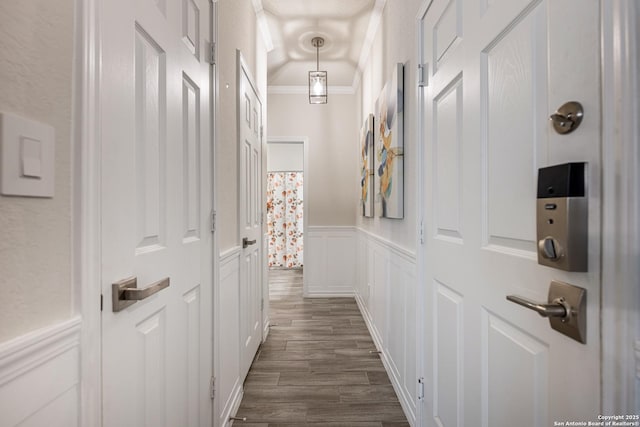 corridor with crown molding and dark hardwood / wood-style floors