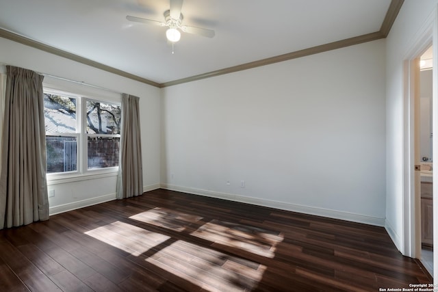 spare room with ceiling fan, crown molding, and dark hardwood / wood-style floors