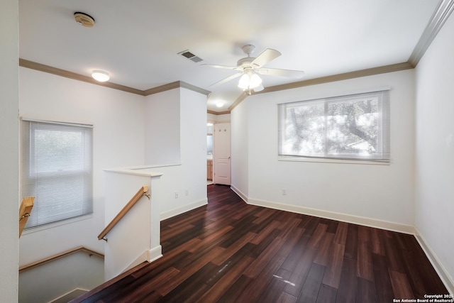 unfurnished room with dark hardwood / wood-style floors, ceiling fan, and ornamental molding