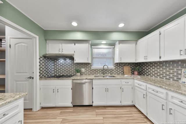 kitchen with white cabinets, sink, stainless steel dishwasher, tasteful backsplash, and light stone counters