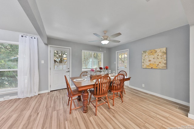 dining area featuring ceiling fan and light wood-type flooring