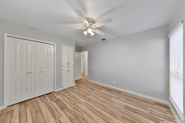 unfurnished bedroom with a closet, ceiling fan, and light hardwood / wood-style flooring