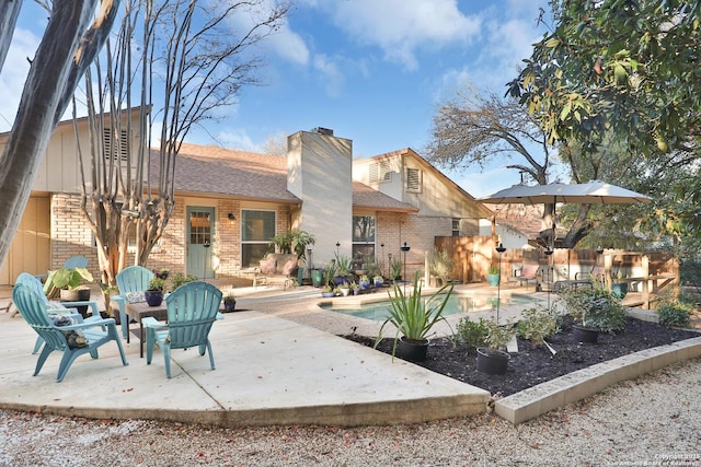 rear view of property featuring a patio area