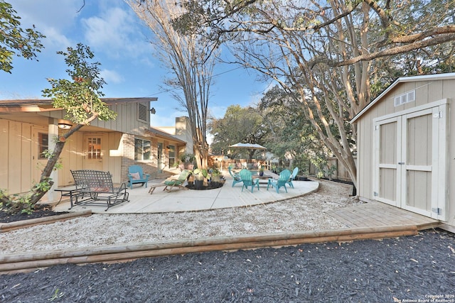 exterior space featuring a patio area and a shed