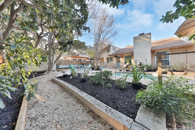 view of yard with a patio area and a fenced in pool