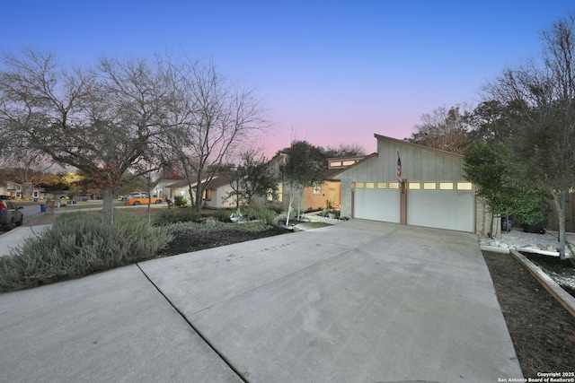 property exterior at dusk with a garage