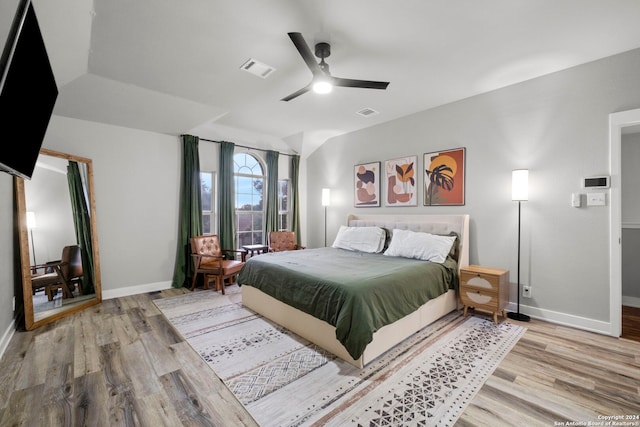 bedroom with ceiling fan and light wood-type flooring