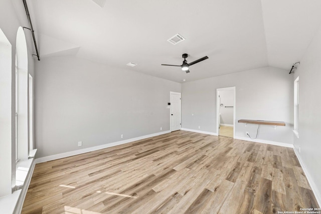 interior space featuring light wood-type flooring, ceiling fan, and vaulted ceiling