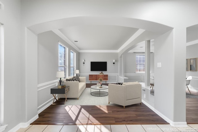 tiled living room featuring a healthy amount of sunlight