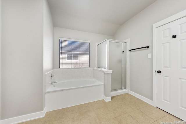 bathroom with tile patterned flooring, lofted ceiling, and shower with separate bathtub