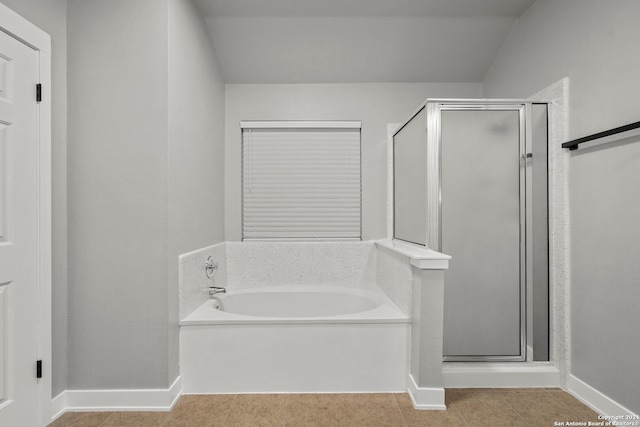 bathroom featuring tile patterned flooring and plus walk in shower