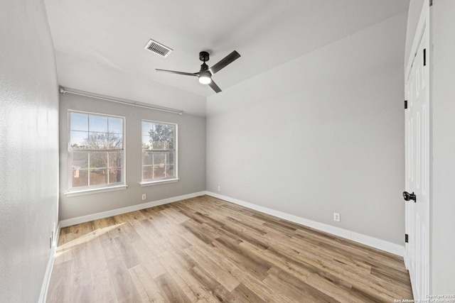 spare room featuring ceiling fan and light hardwood / wood-style flooring