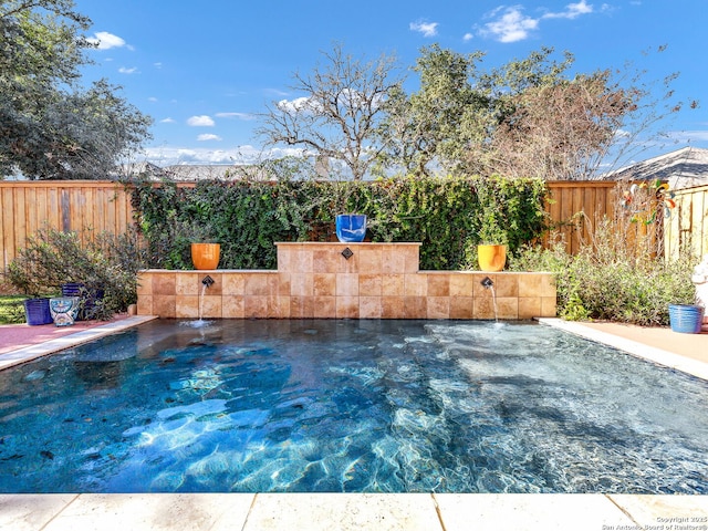 view of pool featuring pool water feature