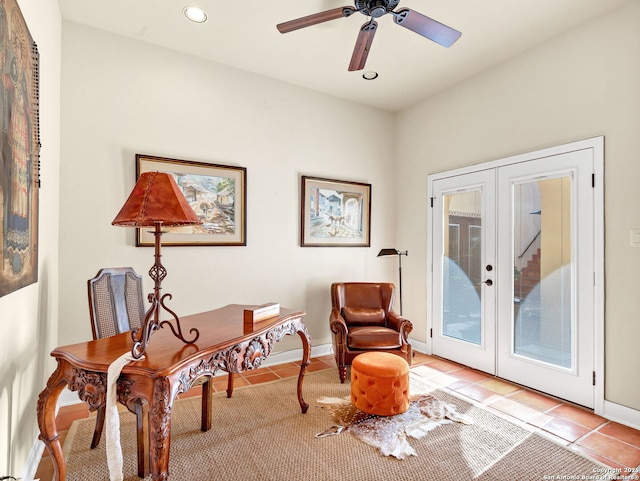 living area featuring ceiling fan, light tile patterned flooring, and french doors