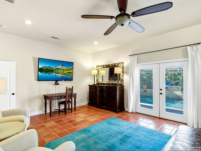 tiled living room with ceiling fan and french doors