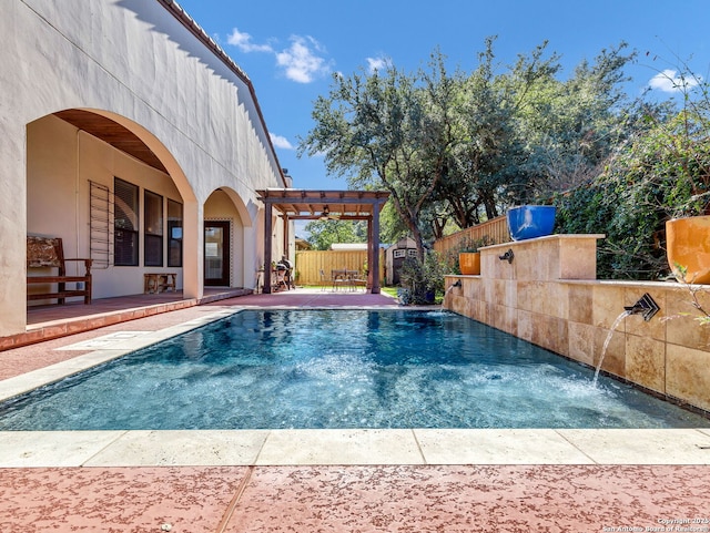 view of swimming pool with a pergola, a patio area, and pool water feature