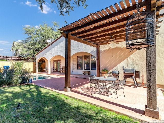 view of patio / terrace featuring ceiling fan and a pergola