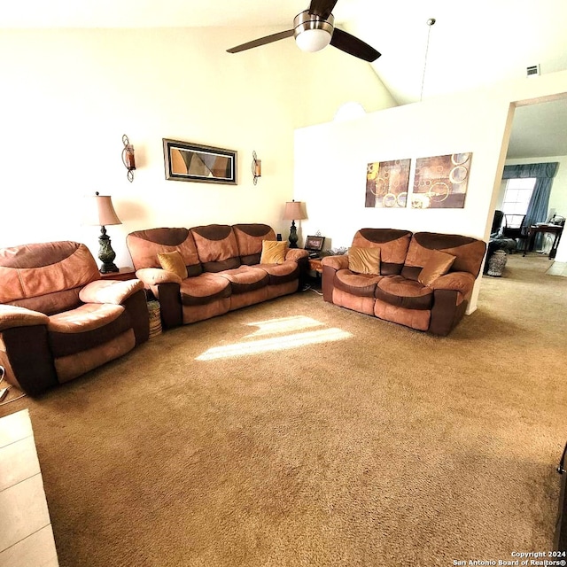 living room featuring ceiling fan, carpet floors, and high vaulted ceiling