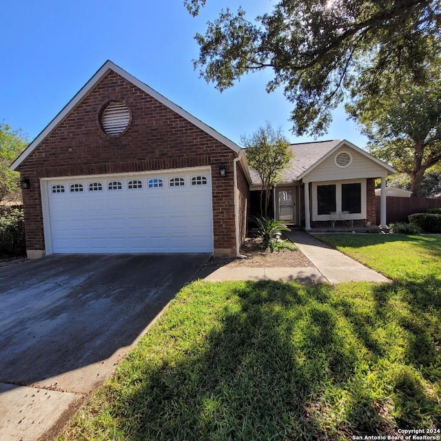 view of front of home featuring a front lawn and a garage