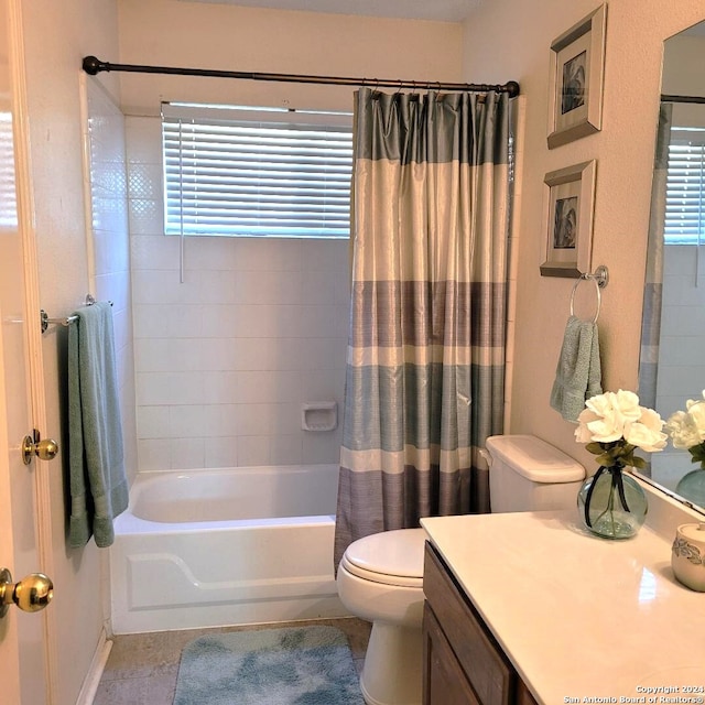 full bathroom with tile patterned flooring, plenty of natural light, toilet, and shower / tub combo with curtain