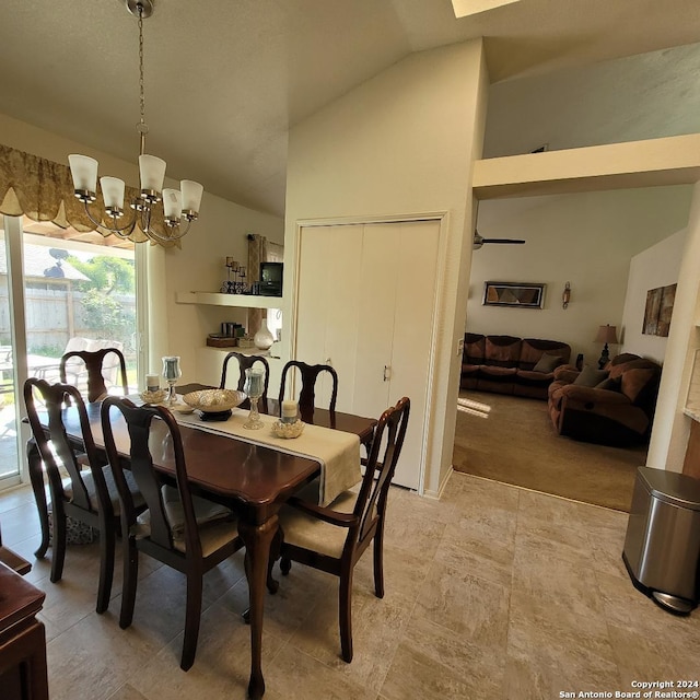 dining room featuring vaulted ceiling and an inviting chandelier