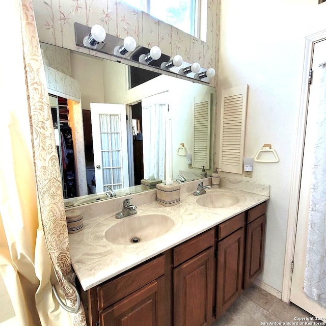 bathroom with tile patterned flooring and vanity