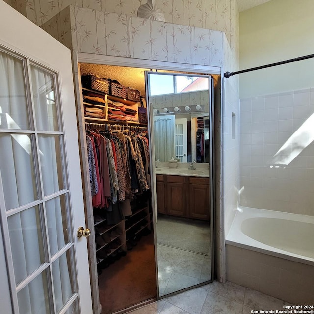 bathroom with tile patterned floors and vanity