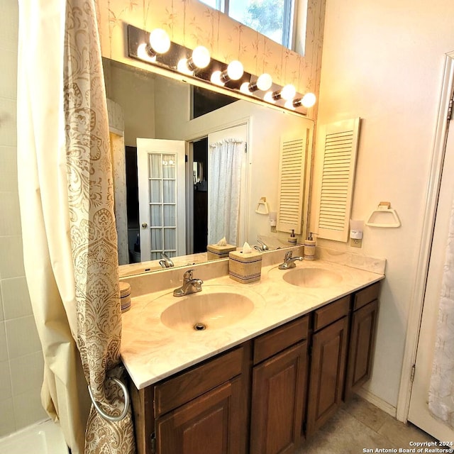 bathroom with tile patterned flooring and vanity