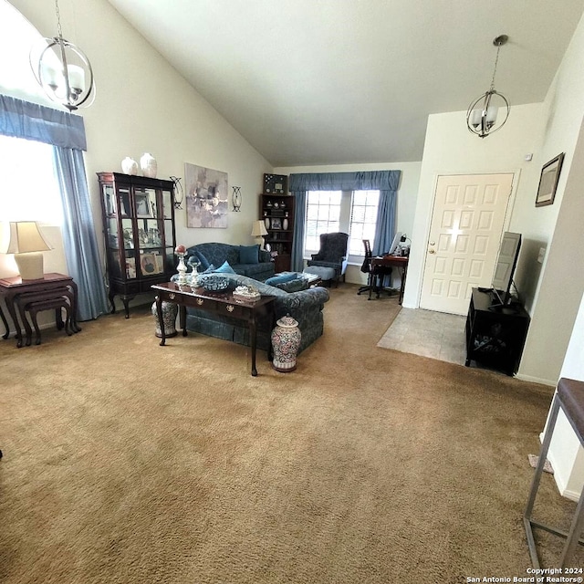 living room featuring a chandelier, carpet floors, and a wealth of natural light