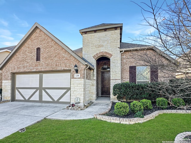 view of front of house with a front lawn and a garage