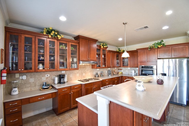 kitchen featuring a center island, hanging light fixtures, stainless steel appliances, tasteful backsplash, and light tile patterned flooring